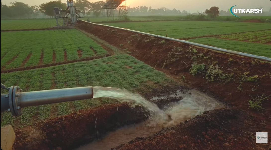 Water flowing through an irrigation pipeline in a field